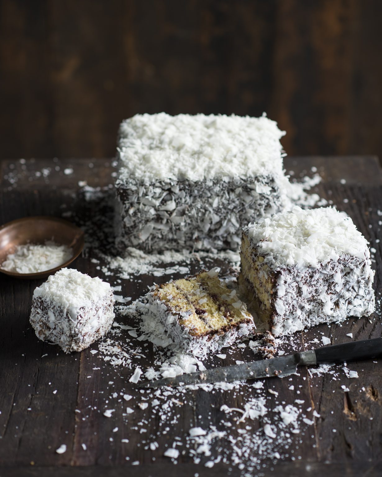 Traditional Australian lamington, coated in chocolate icing and shredded coconut, with a moist sponge interior
