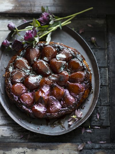 Pear tarte tatin showcasing caramelized pear slices atop a buttery pastry base, delivering a delightful combination of sweet and buttery flavors