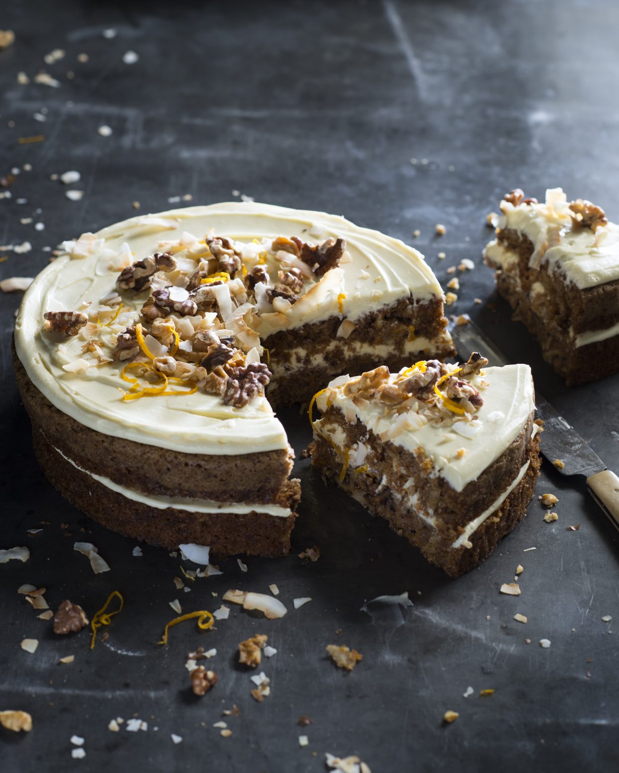 Wholesome carrot cake: a moist and flavorful cake packed with grated carrots, nuts, and warm spices, topped with creamy frosting